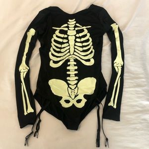 Dolls Kill S voodoo glow skull bodysuit